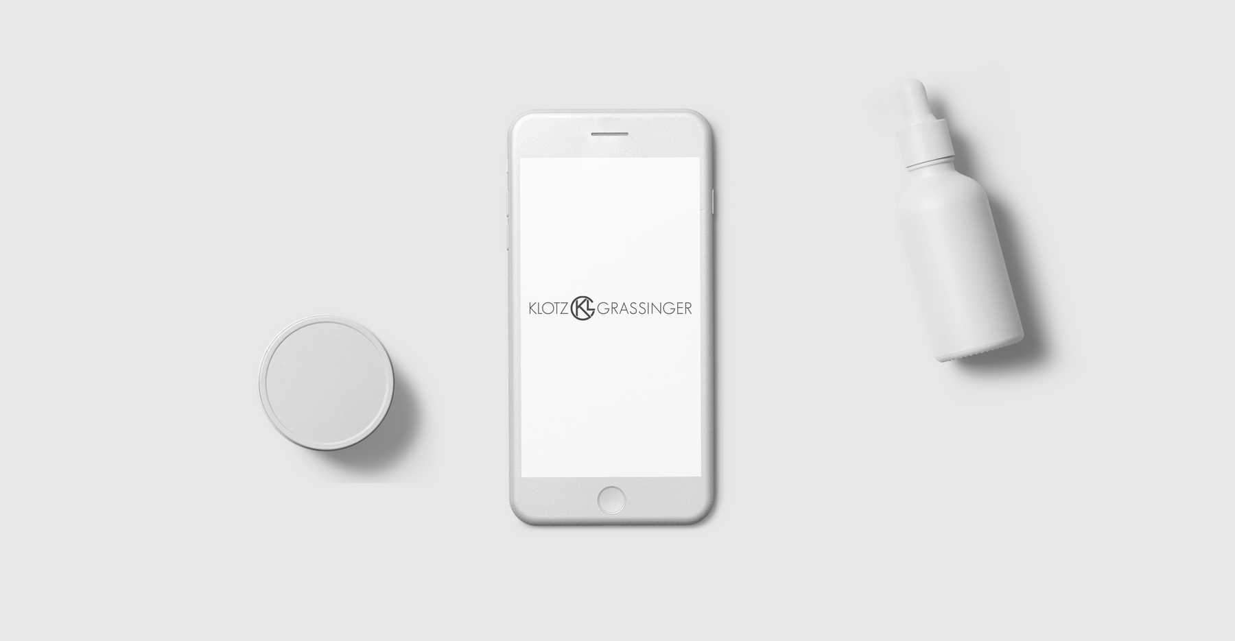 Cell phone and cream packaging in white